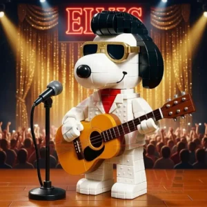 Snoopy figure dressed as Elvis Presley with guitar and microphone on a concert stage with golden lights and crowd in the background!