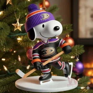 Snoopy Ice Hockey Christmas Ornament 11 A cartoon dog hockey ornament in black and purple displayed on a Christmas tree!