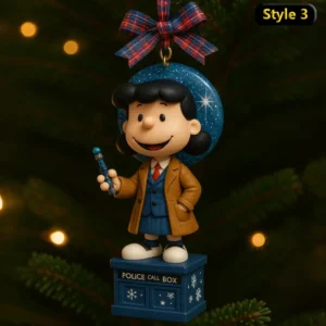 Snoopy x Doctor Who Christmas Ornament 5 Female cartoon Doctor Who ornament with blue base and red plaid ribbon.