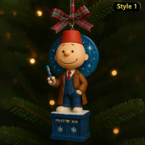 Cartoon Doctor Who themed Christmas ornament on tree with plaid ribbon.