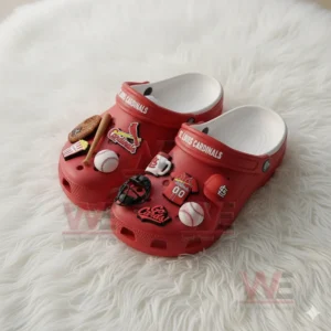 Red St Louis Cardinals Crocs decorated with baseball items and team logos on white rug!