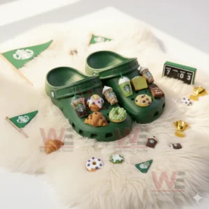 Green Starbucks Crocs with coffee cup and dessert charms placed on white rug with small pastries around!