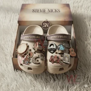 Beige Stevie Nicks clogs with detailed decorations displayed in a branded beige box.