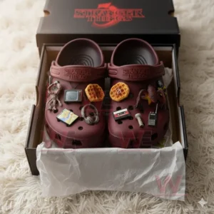 Stranger Things maroon Crocs with themed charms inside black box on white surface!