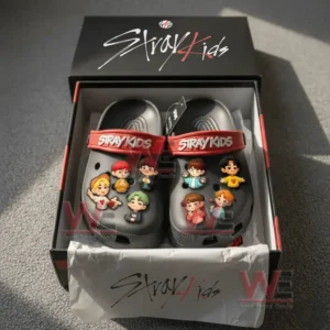 Stray Kids Crocs in their branded box showing cartoon charms on each shoe inside the packaging!