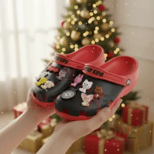 Stray Kids Crocs Crocband Clogs 4 Person holding Stray Kids-themed Crocs with a Christmas tree backdrop.