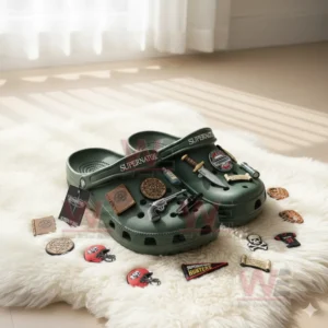 Green clogs with Supernatural decorations placed on a white rug with various themed accessories.