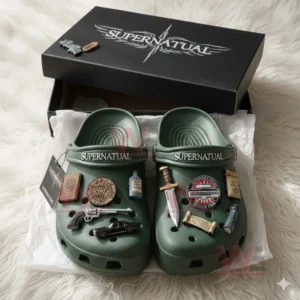 Supernatural Crocs Clogs with Charms 6 Green Supernatural clogs with themed decorations displayed in a black branded box.
