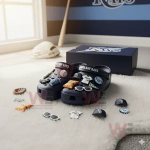 Blue Tampa Bay Rays Crocs with team charms displayed on white rug in sports themed room!
