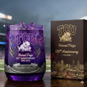 TCU Horned Frogs anniversary glass with ice beside a themed box against a lit stadium background!