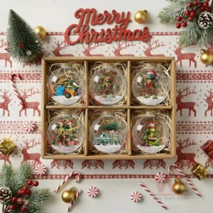 A gift box containing six festive ninja turtle ornaments displayed with Christmas themed surroundings!