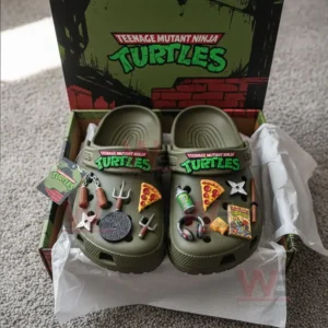 Boxed Teenage Mutant Ninja Turtles Crocs with themed charms and TMNT logo packaging.