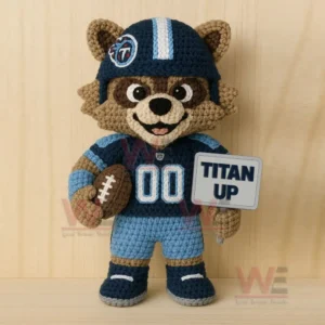 Crocheted blue football themed animal figure holding a brown football and a stitched sign while standing.