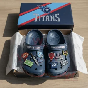 Boxed Tennessee Titans Crocs with football-themed charms and official team logo packaging.