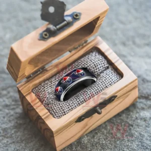 Silver ring with festive emblems inside an open wooden gift box!