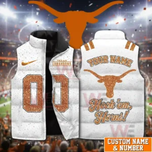 A white Texas Longhorns themed puffer vest with orange numbers and a bold longhorn emblem shown in a festive stadium backdrop!