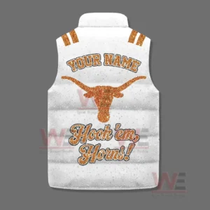 A back facing white puffer vest with an orange longhorn emblem name text and Hook em Horns phrase on a gray background!