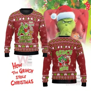 A red holiday sweater with a Merry Grinchmas design shown against a bright festive backdrop!