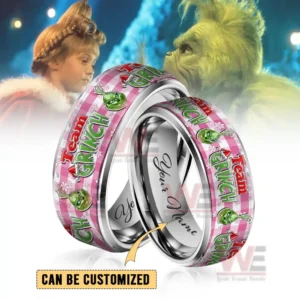 Two silver rings with pink Grinch themed bands and customizable inner engraving!