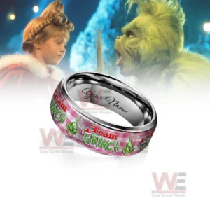 Customizable silver ring with pink Grinch themed pattern before a Grinch movie background!