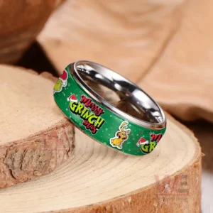 Silver ring on wood with green Merry Grinchmas themed band and character illustrations!