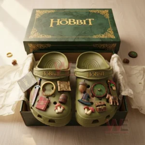 Boxed olive green The Hobbit Crocs with fantasy-themed charms and elegant green packaging.