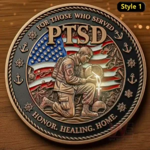 A commemorative coin representing PTSD awareness, with a soldier kneeling and holding a cross against the backdrop of the American flag. The text emphasizes the importance of honor, healing, and home for those who have served.