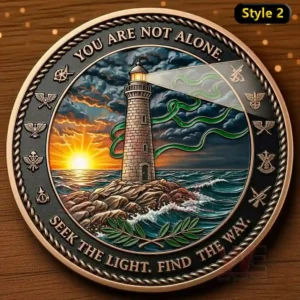 A commemorative coin with a lighthouse shining its light through stormy skies. The text emphasizes the message of hope, saying 