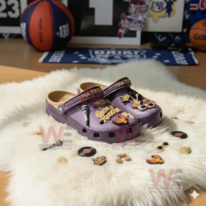 Purple Tina Turner Crocs surrounded by music themed charms like vinyl records and microphones.