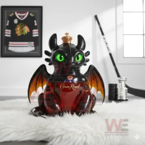 A black dragon decanter with green eyes and orange wings holding red liquid placed on a white fur rug in a sports themed room!