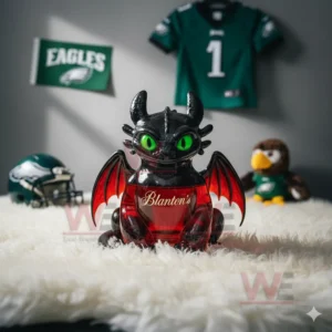 A black dragon decanter with green eyes and orange wings holding red liquid displayed on a white fur rug in a themed sports room!