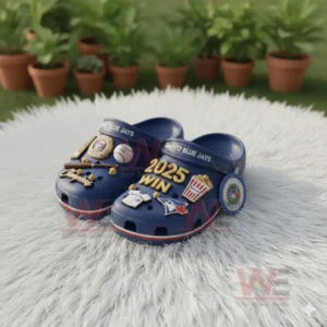 Blue Toronto Blue Jays Crocs with baseball themed charms and 2025 WIN text placed outdoors.