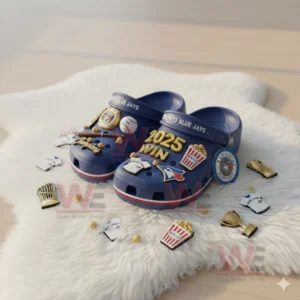 Blue Toronto Blue Jays Crocs with baseball charms surrounded by additional sports themed decorations.