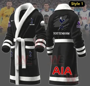 A front and back view of a black Tottenham themed robe with club emblems and sponsor marks!