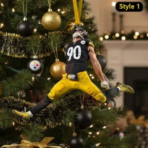 A leaping football player in black and yellow uniform hangs as an ornament on a Christmas tree decorated with gold and black baubles.
