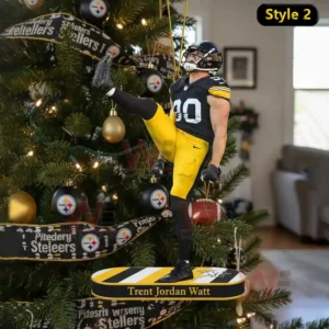 Trent Jordan Watt Pittsburgh Steelers Ornament 4 A football player in black and yellow uniform stands on a long ornament with one leg raised hanging from a Christmas tree decorated with black gold and themed baubles.