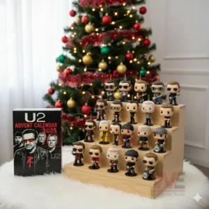 Stylized U2 collectible figures on a wooden stand beside an advent calendar with a Christmas tree behind.
