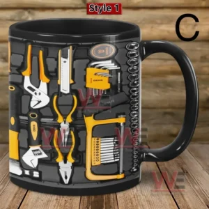 A black mug with yellow and black mechanic tools printed across the surface!