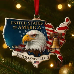 An ornament shaped like the United States map displaying a bald eagle head and patriotic colors hanging on a Christmas tree! ``