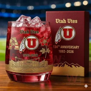 Utah Utes 1892-2026 134th Anniversary Whiskey Glass 5 A Utah Utes themed iced drink glass placed next to an anniversary box with a lit stadium behind it!