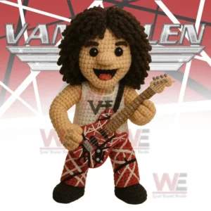 Crocheted musician figure with curly hair holding a red patterned guitar in front of a music themed backdrop.