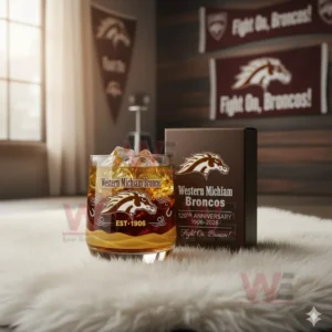 Western Michigan Broncos anniversary glass with amber drink and ice displayed in a football themed room!