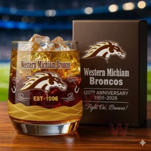 Western Michigan Broncos 120th Anniversary Whiskey Glass 3 Western Michigan Broncos anniversary glass with amber drink and ice shown beside a commemorative box in a stadium environment!