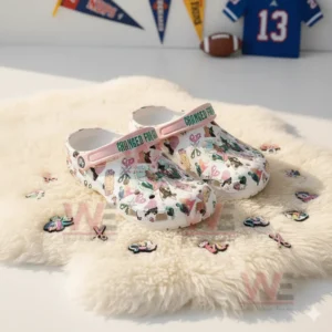 "Changed for Good" themed Crocs with colorful illustrations and pink and green straps.