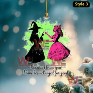 Alt text: Wicked ornament with Elphaba and Glinda silhouettes and the Change for Good quote.
