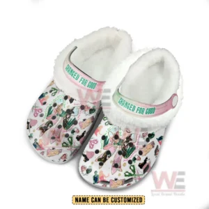 Fleece lined clogs with colorful themed illustrations and a pastel customizable strap shown on a white background!