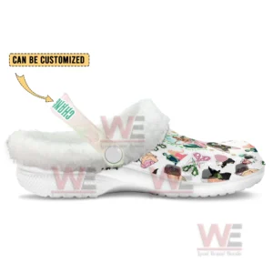 A side view of a fleece lined clog with bright themed graphics and a customizable pastel strap!