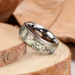 Silver ring on wood with beige Winnie the Pooh illustrated band!