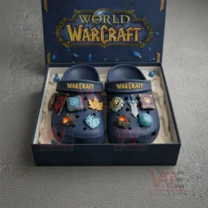 Blue World of Warcraft clogs in a box decorated with multiple fantasy themed charms!