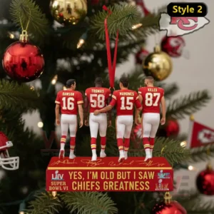 Yes Im Old but I saw Chiefs Greatness Ornament 3 A detailed view of a Chiefs themed ornament hanging on a Christmas tree showing four figures in red uniforms on a structured display base!